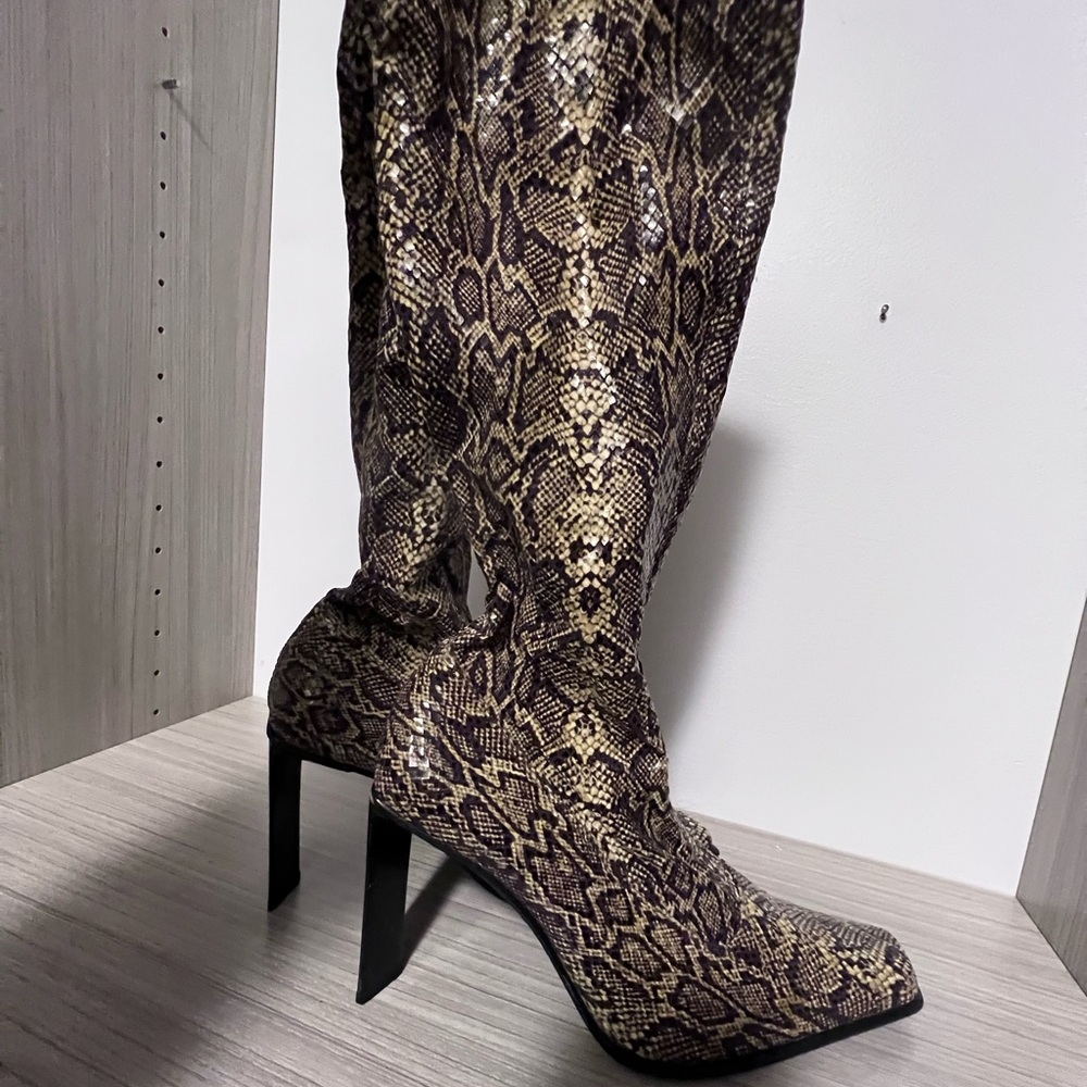 Bebe Snake print boots